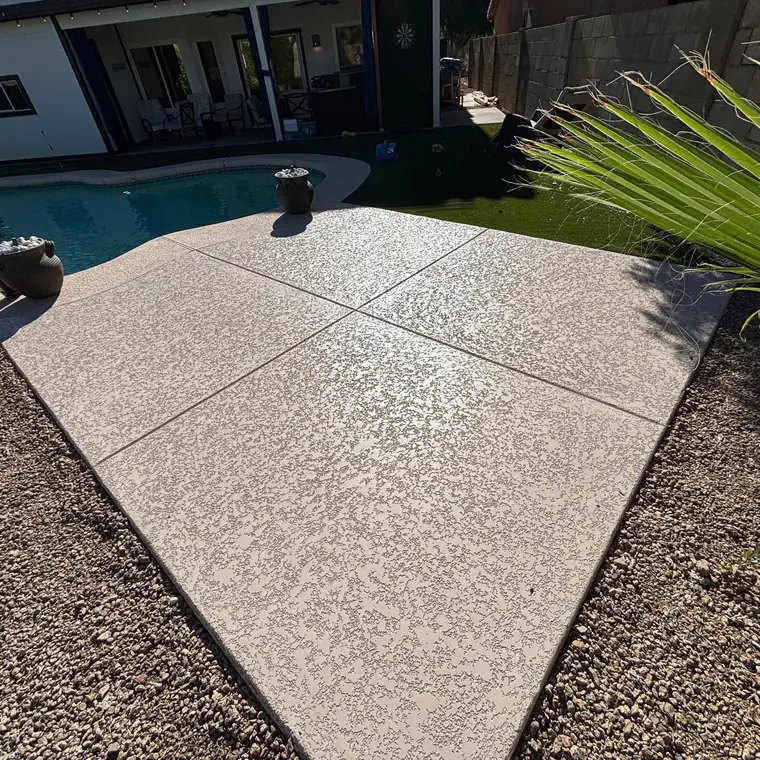 Resurfaced cool deck around a pool